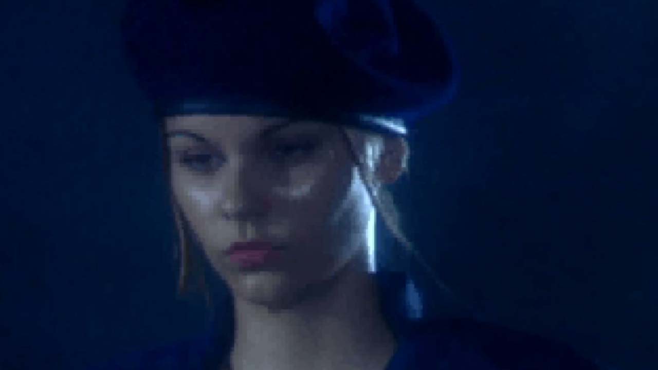 Jill Valentine, a woman in a beret and uniform, from the live action Resident Evil intro.